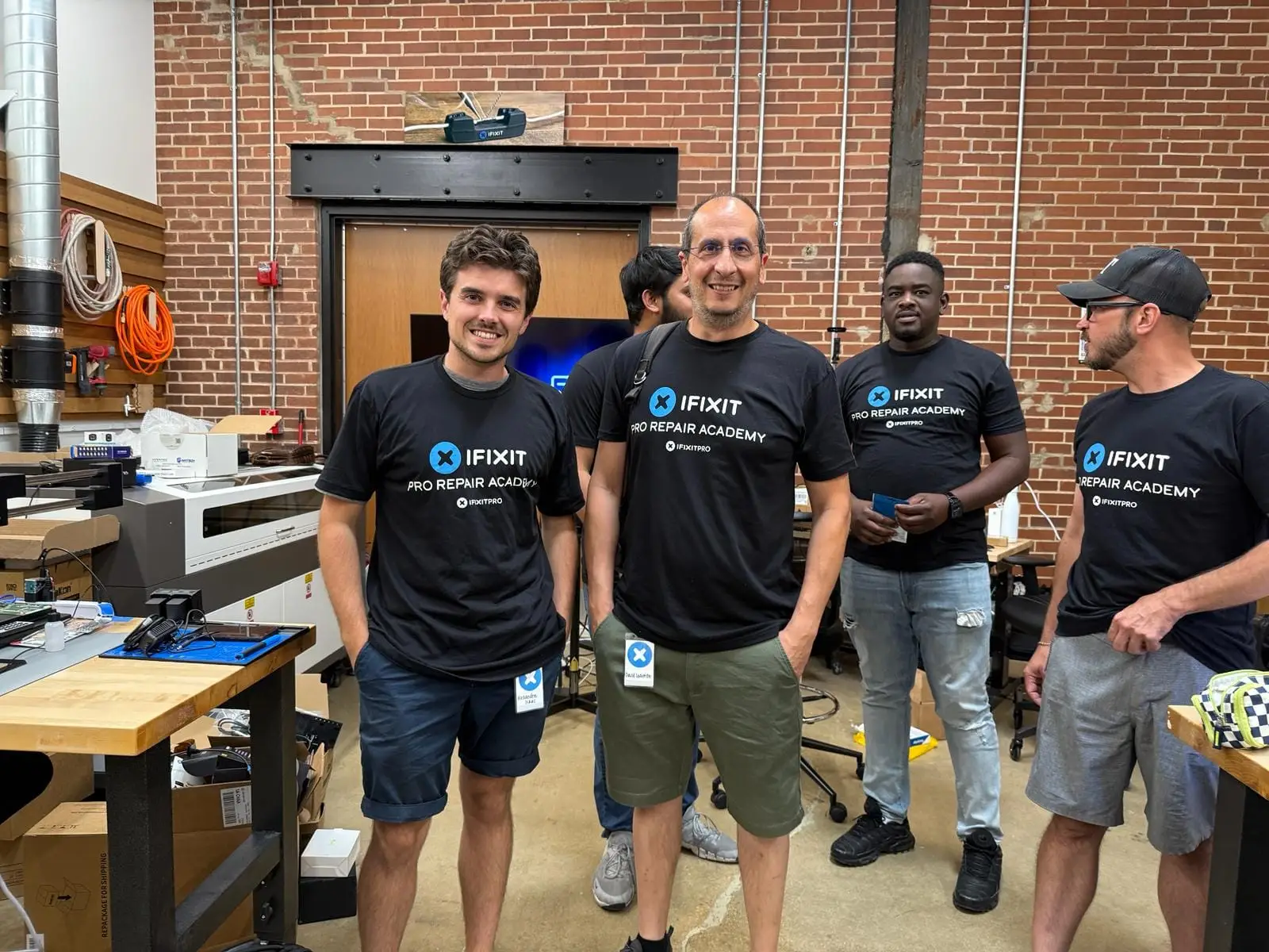 Alexandre Isaac and David Lecomte of The Repair Academy with students
