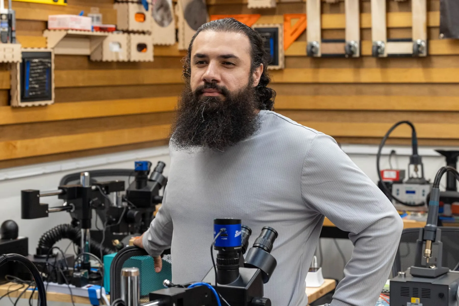 A student at a microsoldering station at iFixit HQ